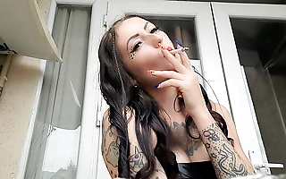 Femdom-goddess Nika smokes a cigarette and blows smoke in your face. Smoking fetish. The good-luck piece of cigarette smoke.